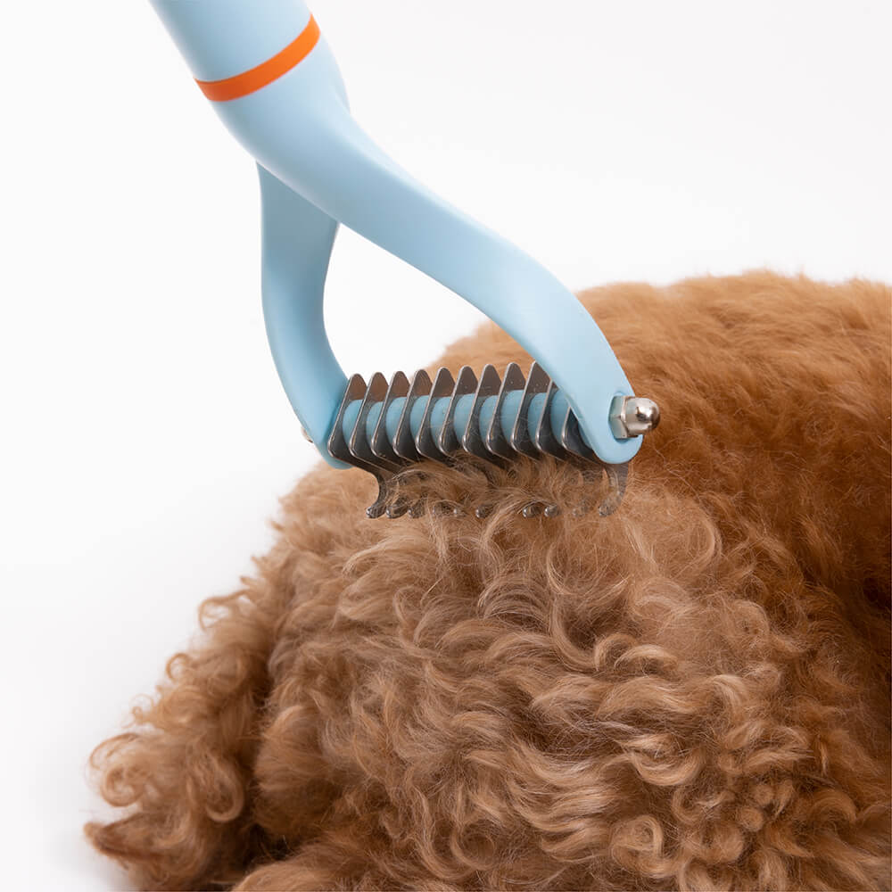 Rastrillo de peine desenredante seguro para mascotas con cuchillas de doble cara y cinta